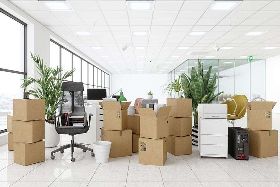 Office furniture and boxes ready for storage