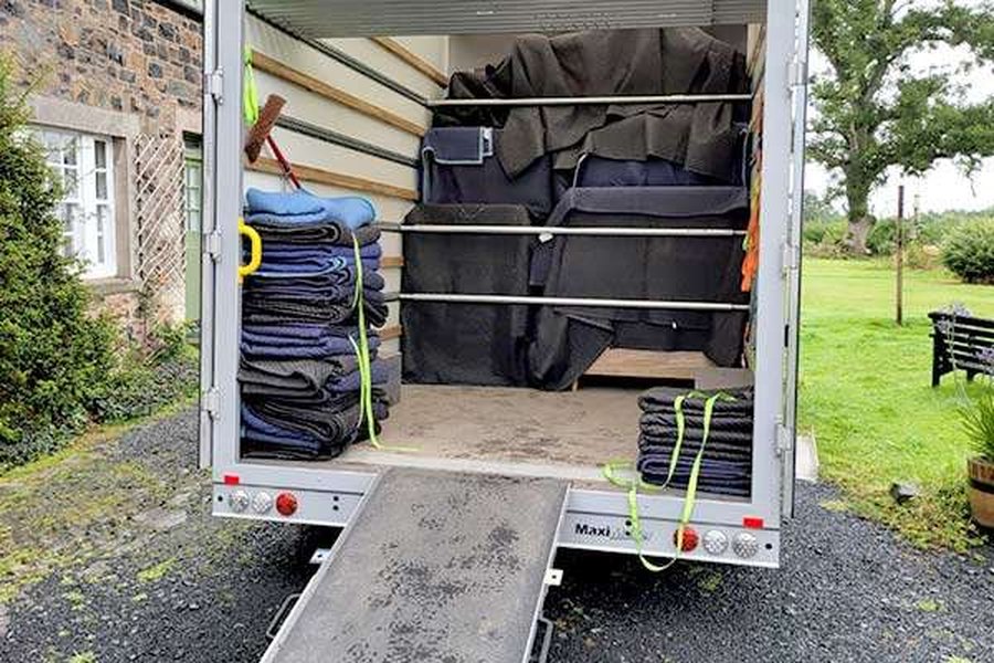 A Browns removal van loaded with blanket-wrapped furniture